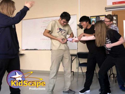 a group of young people standing around each other