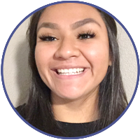 a woman with long dark hair smiling at the camera