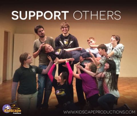 a group of people standing around each other